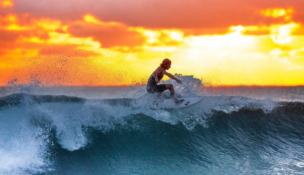 Surfing waves, Sunset in Bali